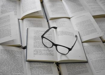 photo of a book and glasses